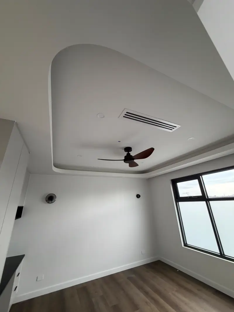 Curved Bulkhead Ceiling — Soft curved bulkhead framing the bedroom ceiling.