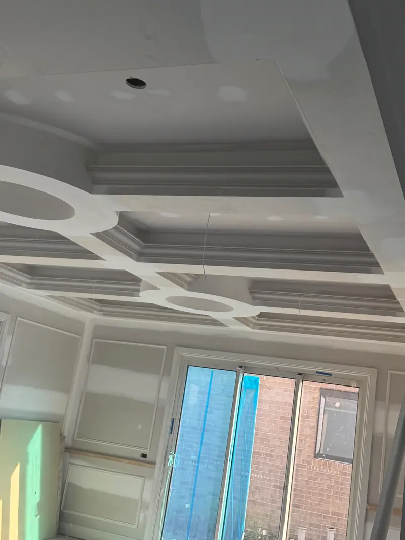 Coffered ceiling with circular details, before finishing