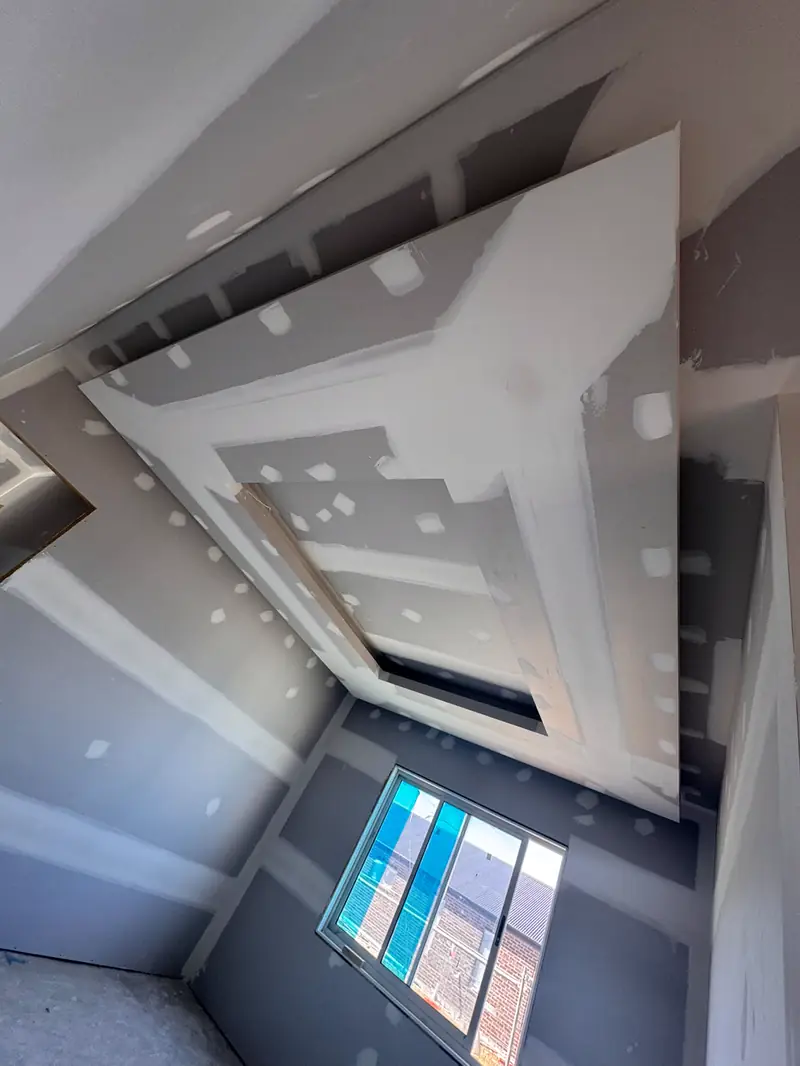 Angular ceiling bulkheads being built in plasterboard