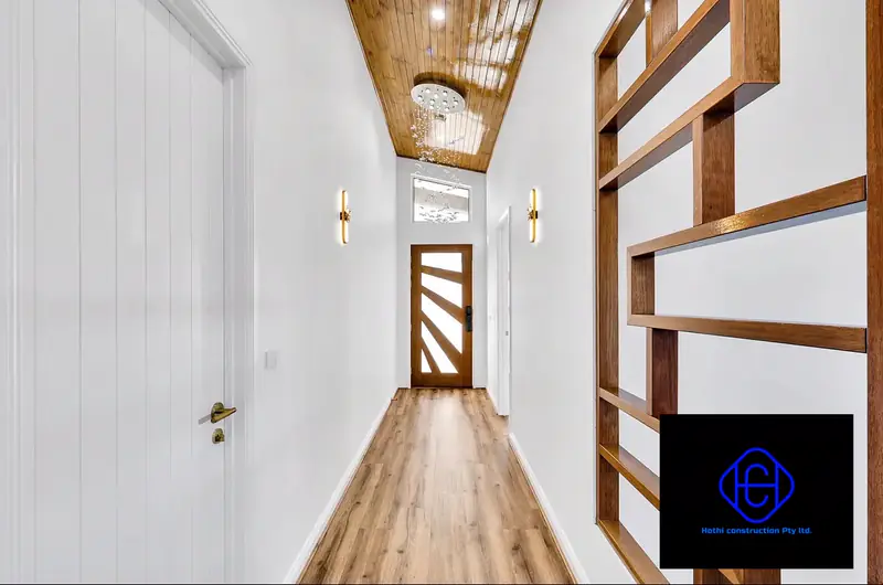 Hallway with timber-lined ceiling and timber feature screen