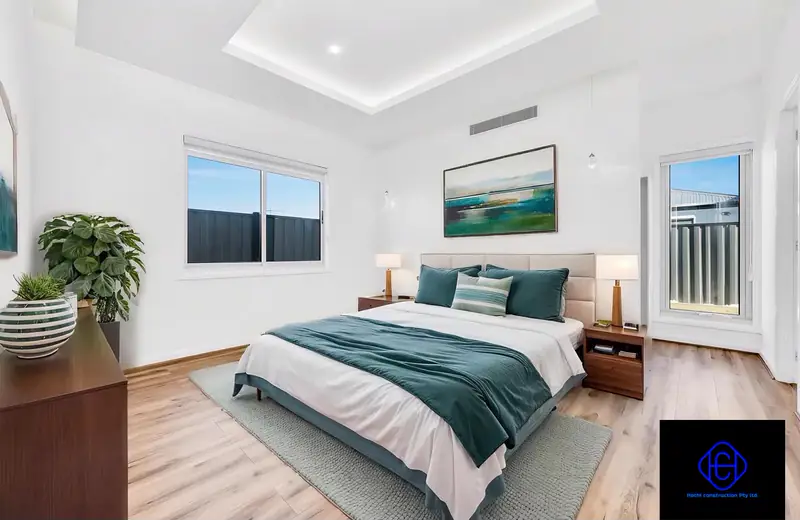 Master bedroom with recessed ceiling and feature wall — Beveridge